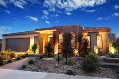 Modern House with Palm Tree in Front of it